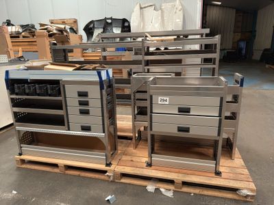 two ovens sitting on a pallet in a warehouse