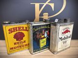three tins that are sitting next to each other