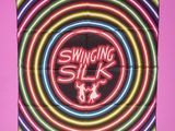 a close up of a neon sign on a pink background