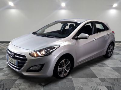 the silver car is parked on a checkered tile floor