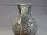 a small vase that is sitting on a table