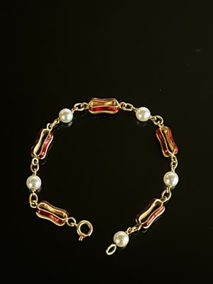 Bracelet  articulé, en or jaune 18K, orné de mailles ajourées émailées - Photo 1