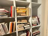 many books on the shelves in the room
