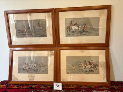 three framed pictures of horses and jockeys on a red rug