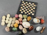 a chess board and some rocks on a table