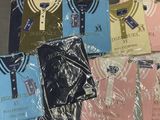 a lot of t - shirts that are wrapped in plastic