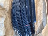 a box with a bunch of plastic brushes in it