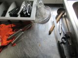 many utensils that are sitting on the kitchen counter