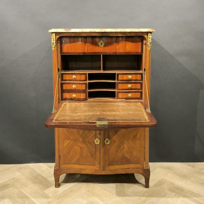 an old wooden desk with drawers and drawers on top of it