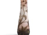 a glass vase with a floral design on it