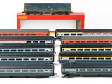 a lot of toy trains that are sitting on top of each other