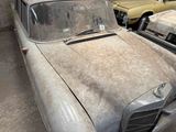 many old cars that are parked in a lot
