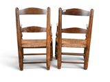 pair of antique oak ladderback chairs with cane seats