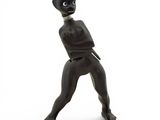 statue of an alien with a gun in his hand on a white background
