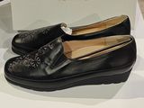 black leather loafers on display in a shoe store
