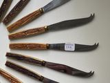 a lot of knives that are arranged in a circle