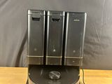 an image of three batteries are on a stand on a table