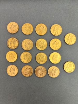 a close up of a bunch of gold coins on a table