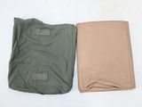 two different colors of t - shirts laying next to each other on a white surface