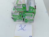 a stack of newspapers sitting on top of a white table