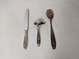 two spoons and a knife on a table