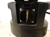 a close up of a black electrical outlet on a table