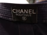 a close up of a chanel label on a black shirt