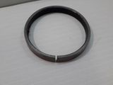 a close up of a metal ring on a white surface