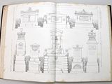 an open book with a drawing of a monument in it