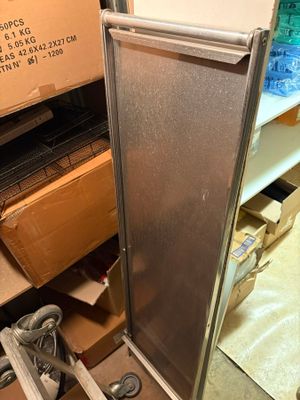 a refrigerator that is sitting in the middle of a pile of boxes