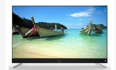 two boats that are sitting in the water on the beach