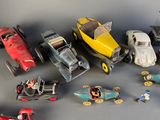 a lot of toy cars that are sitting on a table