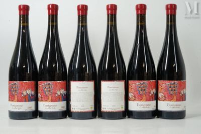 six bottles of red wine are lined up on a table