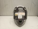 a close up of a helmet on a table with a tag on it