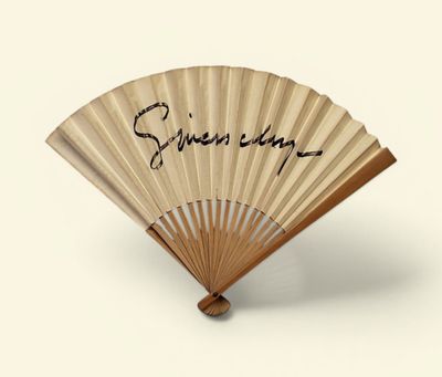 a fan that has writing on it with writing on it