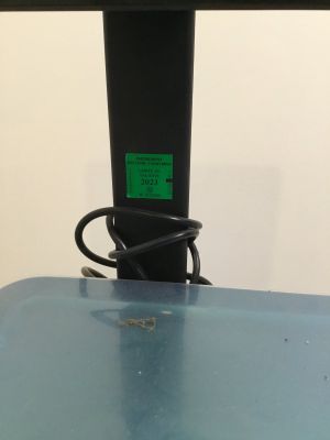 a close up view of a glass table with a cable attached to it