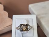 a ring that is sitting in a box on a table