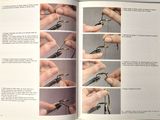 a book with instructions on how to tie a pair of scissors
