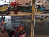 many tools on a shelf in a garage