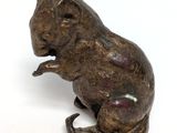 bronze figurine of a mouse sitting on its hind legs