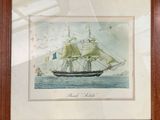 framed picture of a ship in the water with a flag on it