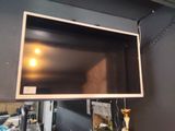 a flat screen tv mounted on the wall in a room
