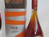 a bottle of wine and a glass of wine next to a box