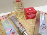 a bottle of lotion and a tube of lotion sitting on a table