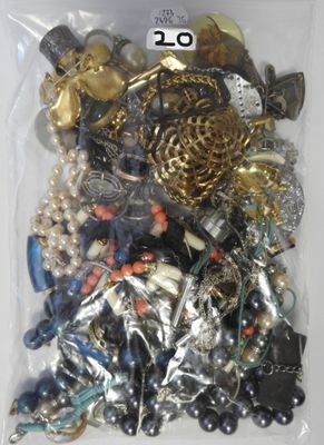 a bag full of assorted jewelry on a table