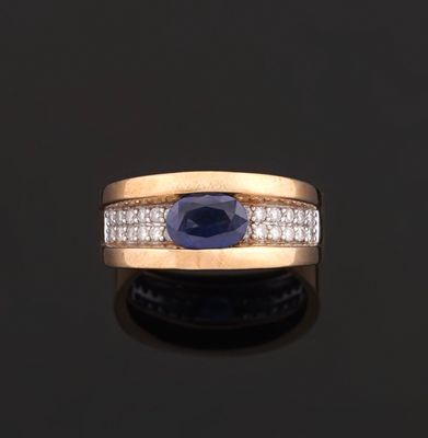 an oval sapphire and diamond ring