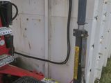 an image of a dump truck parked in the grass
