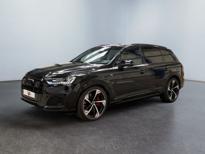 a black audi suv parked in an empty room