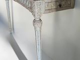 a white table with a wooden top and a drawer on it