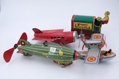 three toy airplanes that are sitting next to each other